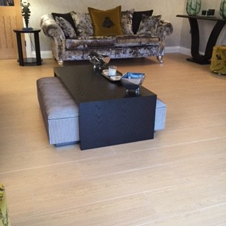 Inspiration for a contemporary formal enclosed living room in Surrey with grey walls and light hardwood flooring.