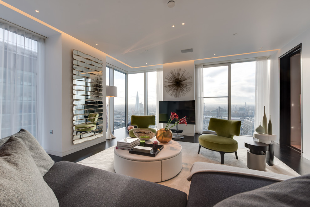 This is an example of a contemporary living room in London with a freestanding tv.