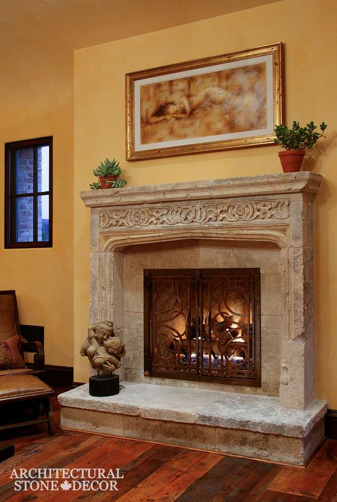 トロントにある中くらいな地中海スタイルのおしゃれなLDK (ライムストーンの床、標準型暖炉、石材の暖炉まわり) の写真