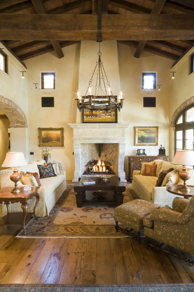 Inspiration for a rustic living room remodel in Denver with beige walls