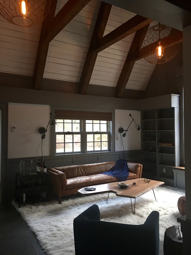 Example of a small transitional loft-style slate floor and gray floor living room design in New York with gray walls, a standard fireplace, a stone fireplace and a media wall
