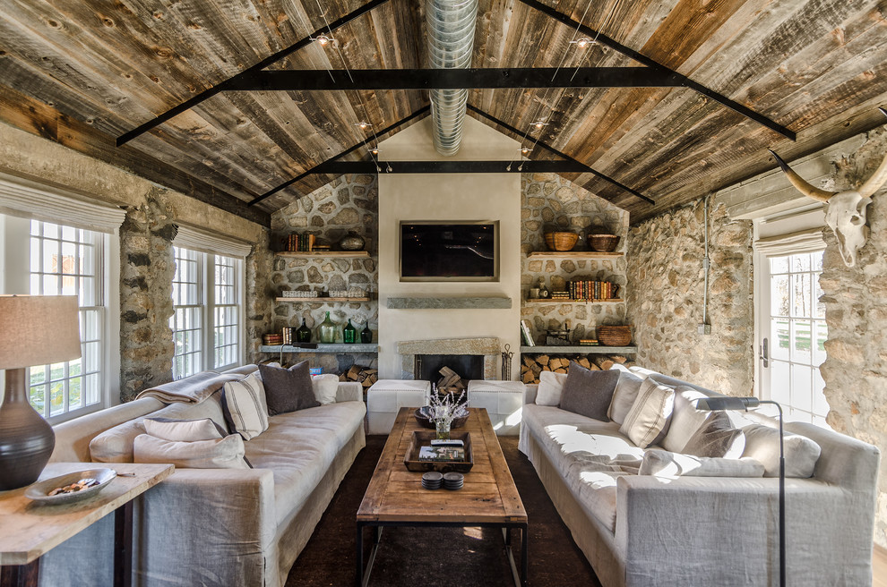 Medium sized rural living room in New York with a standard fireplace and a wall mounted tv.