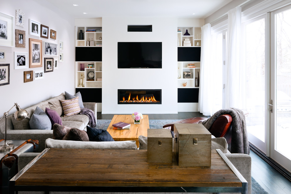 Living room - contemporary formal dark wood floor living room idea in Toronto with white walls, a ribbon fireplace and a wall-mounted tv