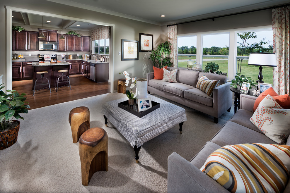 Large classic open plan living room in Charlotte with medium hardwood flooring.