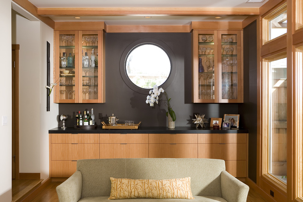 World-inspired living room in San Francisco with a home bar and black walls.