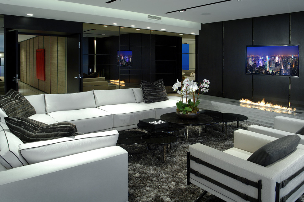 Contemporary formal enclosed living room in Miami with black walls and a wall mounted tv.