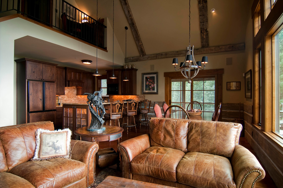This is an example of a medium sized rustic living room in Denver with beige walls.