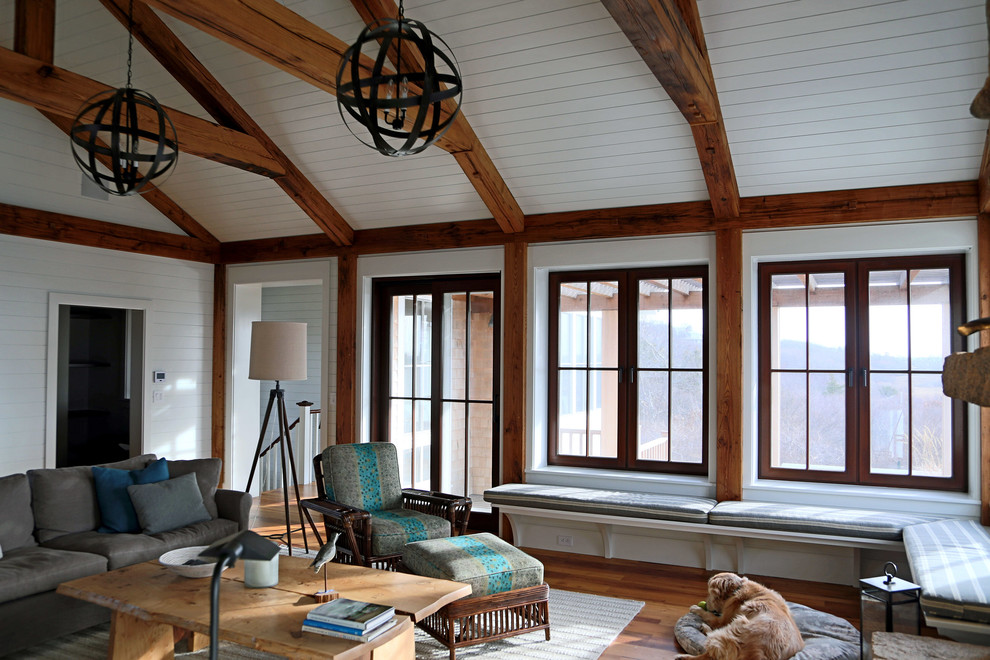 Living room - coastal loft-style medium tone wood floor living room idea in Boston