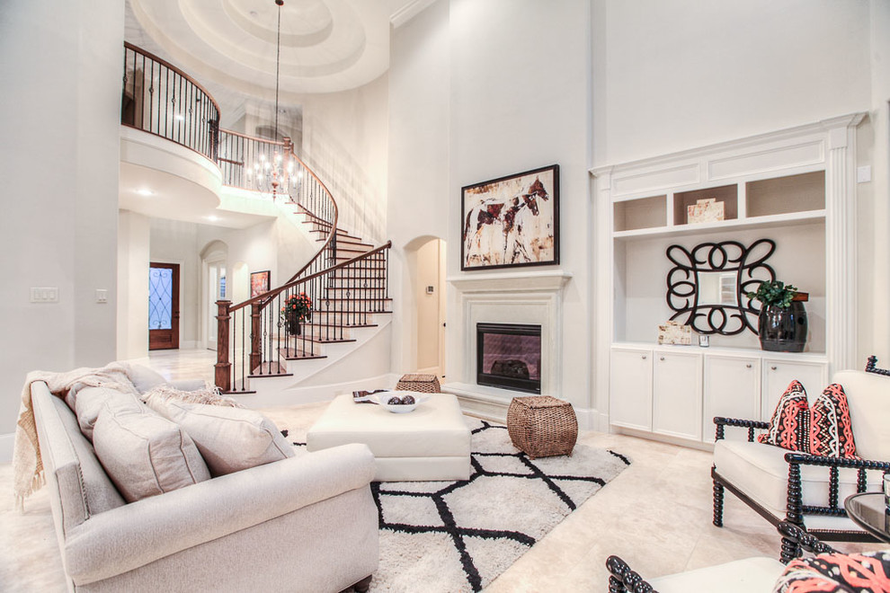 Inspiration pour un salon traditionnel avec un mur blanc, une cheminée standard et un escalier.