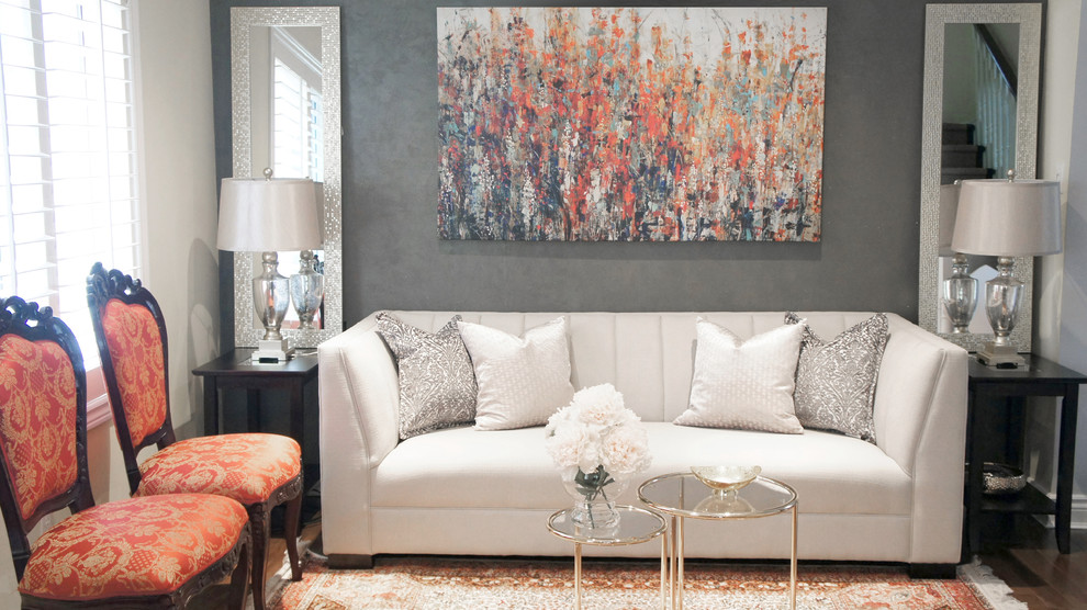 Medium sized contemporary formal enclosed living room in Toronto with multi-coloured walls and medium hardwood flooring.