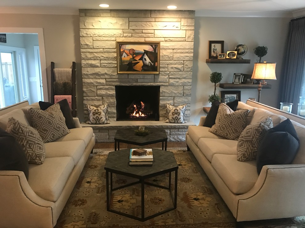 This is an example of a small traditional open plan living room in Chicago with beige walls, dark hardwood flooring, a standard fireplace and a stone fireplace surround.