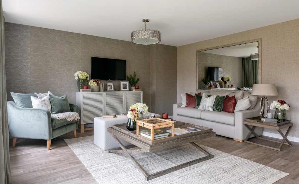 Photo of a contemporary living room with grey walls, medium hardwood flooring, no fireplace, a wall mounted tv and brown floors.