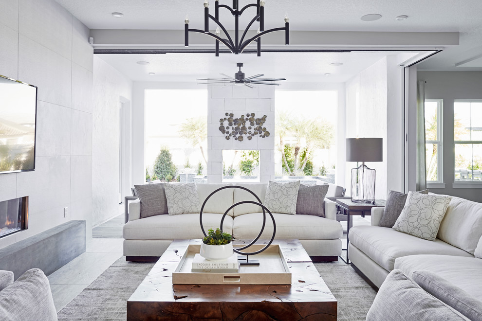 Design ideas for a classic living room in San Diego with a ribbon fireplace, a wall mounted tv and grey floors.