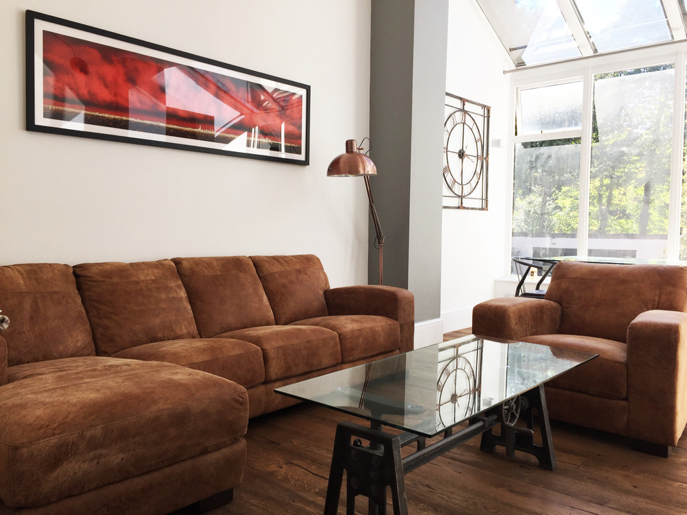This is an example of an industrial open plan living room in London.