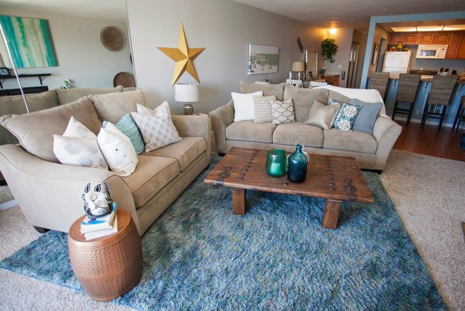 Example of a small beach style open concept living room design in San Diego with gray walls and a tv stand