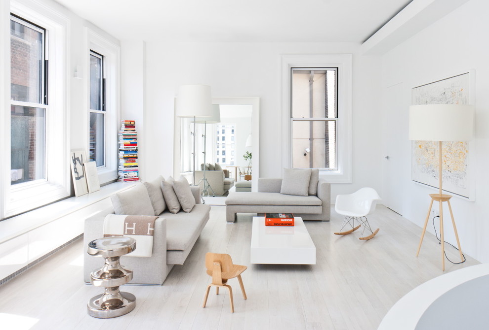 Inspiration for a scandinavian light wood floor and white floor living room remodel in New York with white walls and no fireplace