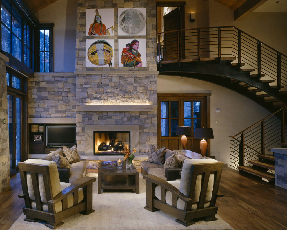 Design ideas for a classic open plan living room in Denver with a standard fireplace, a stone fireplace surround and a wall mounted tv.