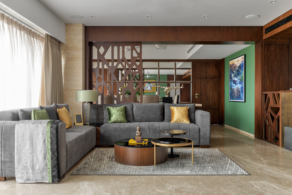 Imagen de salón abierto actual grande con paredes verdes y suelo gris
