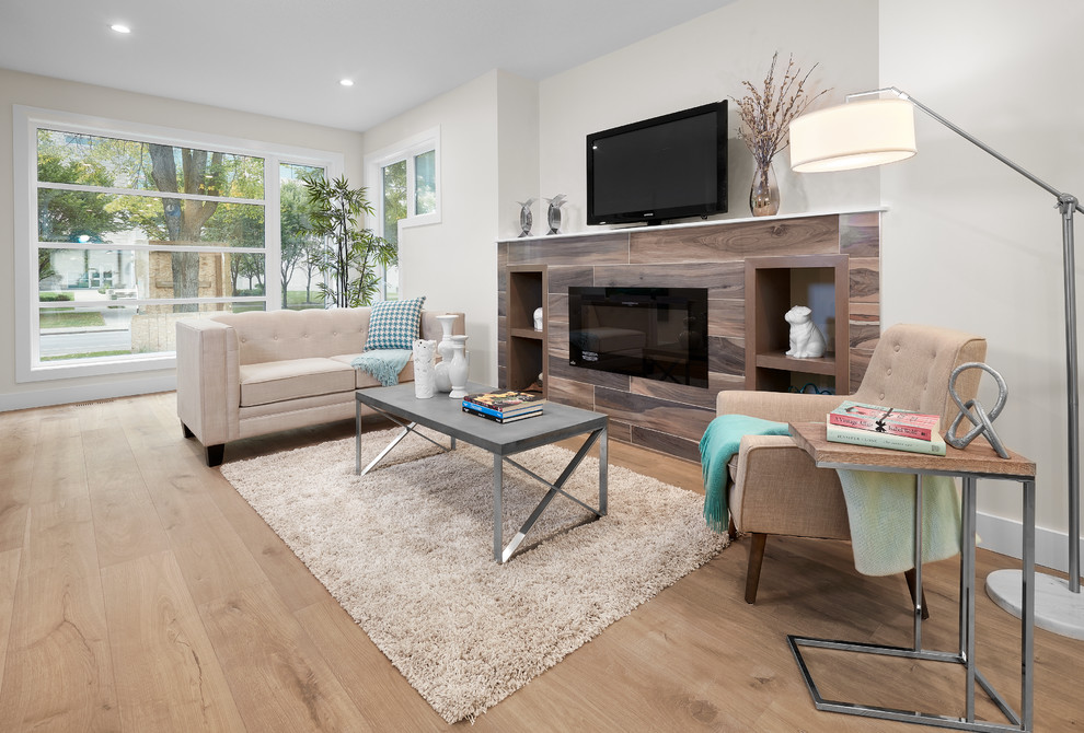 Photo of a medium sized contemporary open plan living room in Edmonton with medium hardwood flooring and white floors.