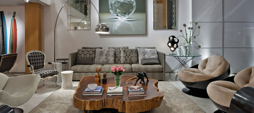 Example of a large trendy open concept concrete floor living room design in Miami with white walls, no fireplace and no tv