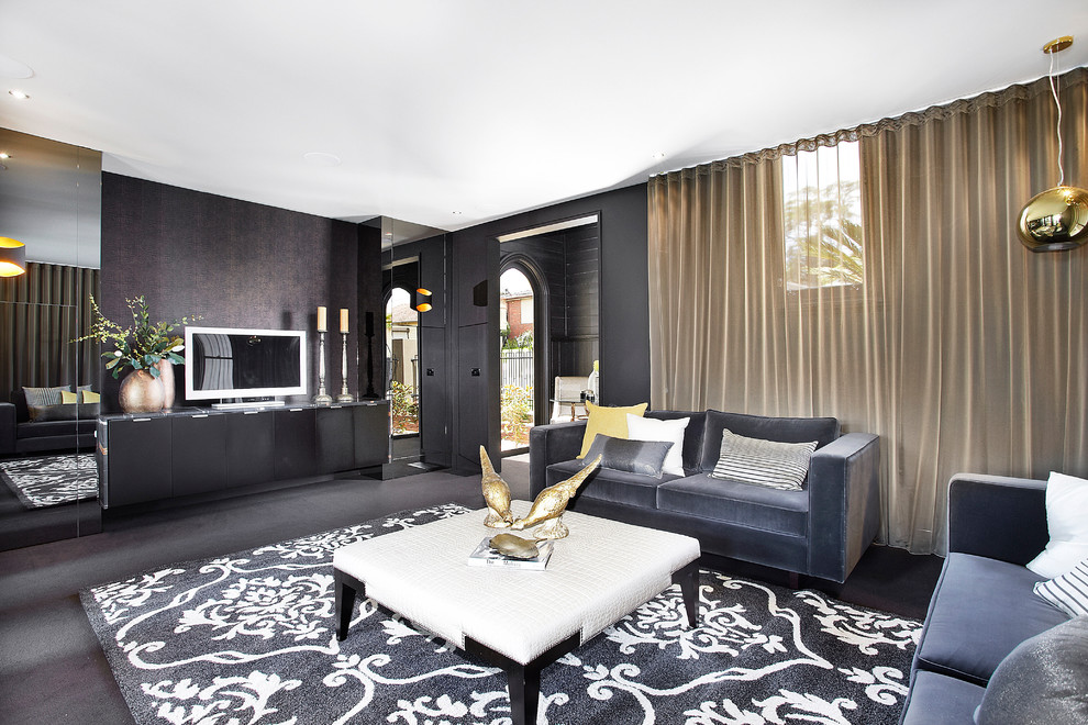 Источник вдохновения для домашнего уюта: гостиная комната среднего размера в современном стиле с черными стенами, отдельно стоящим телевизором, ковровым покрытием и ковром на полу без камина