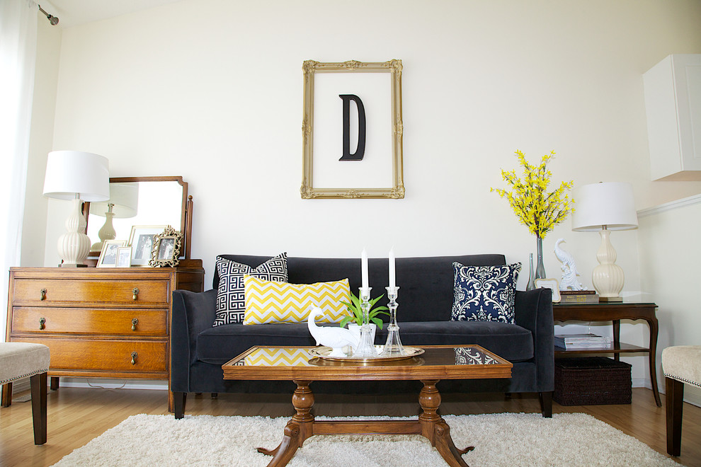 Example of a mid-sized trendy medium tone wood floor living room design in Other with white walls