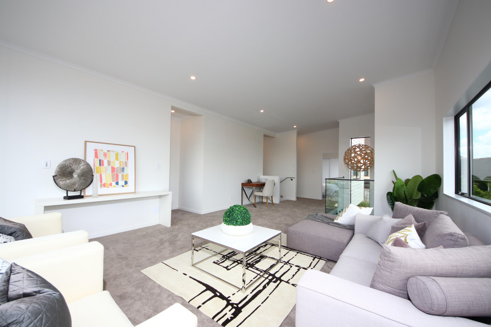 Inspiration for a medium sized modern formal open plan living room in Auckland with white walls, light hardwood flooring, no tv and beige floors.