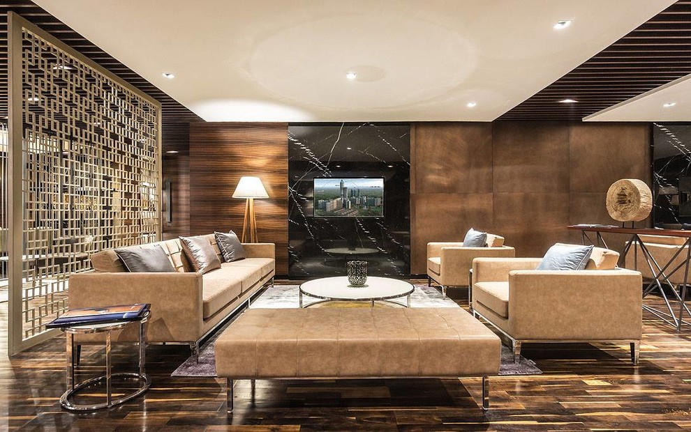 Photo of a medium sized modern open plan living room in Mumbai with brown walls, dark hardwood flooring and black floors.