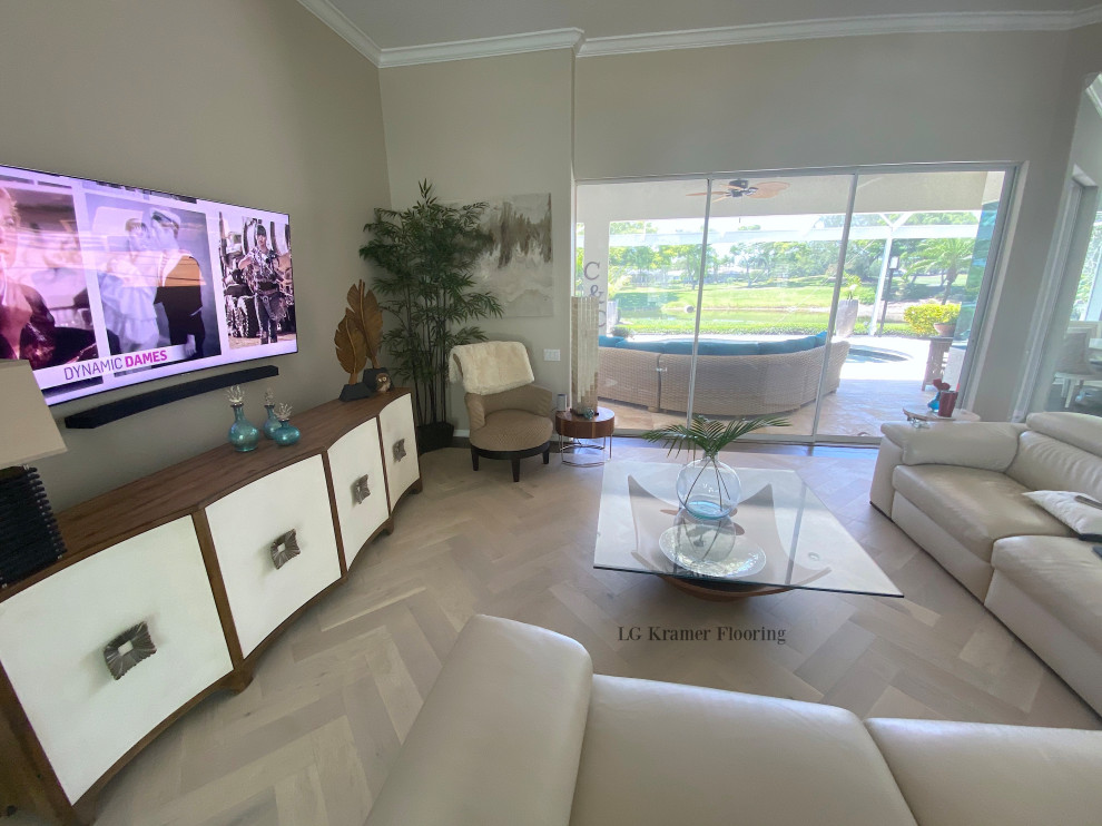Large modern living room in Tampa with beige floors and light hardwood flooring.