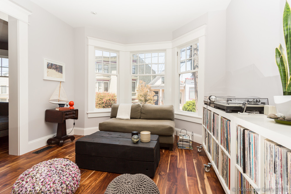 Mid-sized trendy enclosed medium tone wood floor living room photo in San Francisco with a music area and no tv