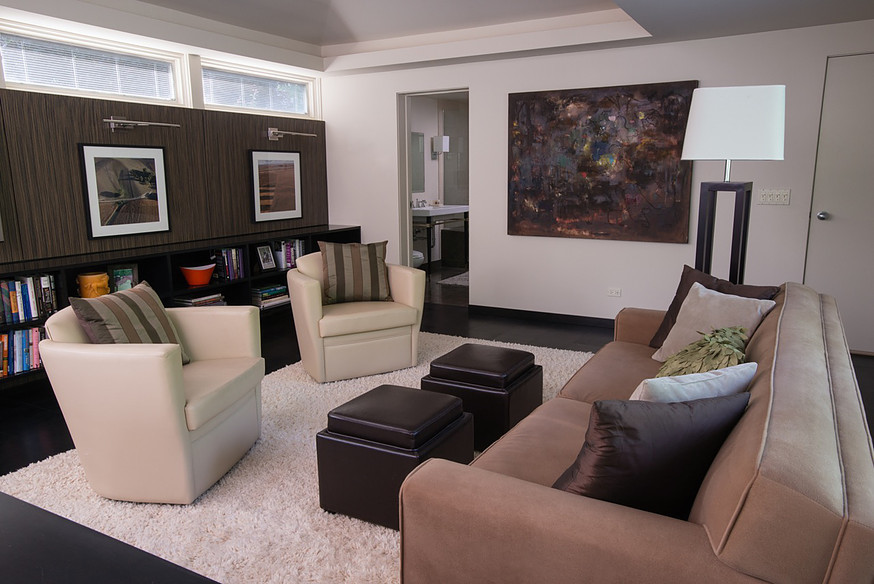 Living room - mid-sized modern formal and enclosed dark wood floor and black floor living room idea in Orange County with white walls, no fireplace and no tv