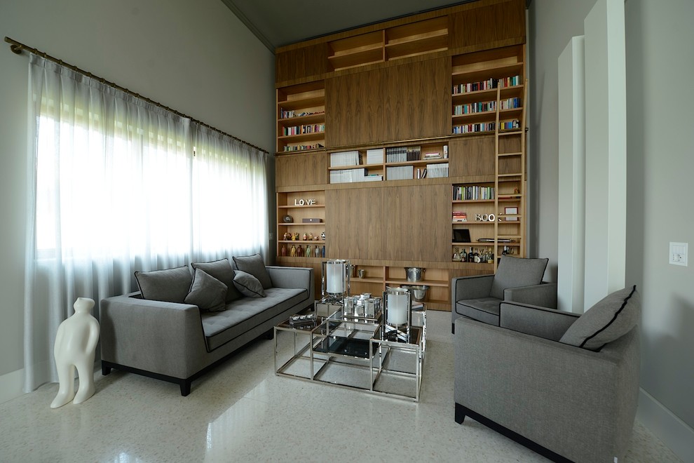 Esempio di un grande soggiorno contemporaneo con libreria e pareti bianche