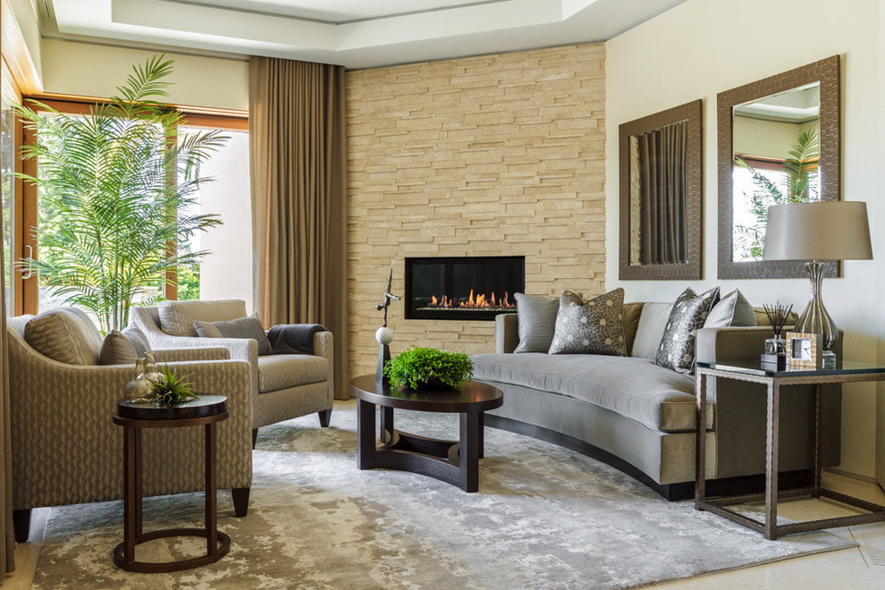 Inspiration for a classic formal and grey and cream enclosed living room in Orange County with beige walls, carpet, no fireplace, a stone fireplace surround, a built-in media unit and grey floors.