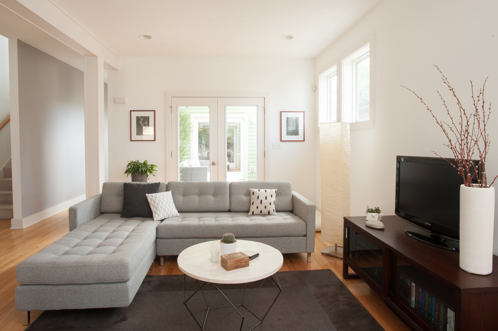 Inspiration for a contemporary living room remodel in Other with white walls