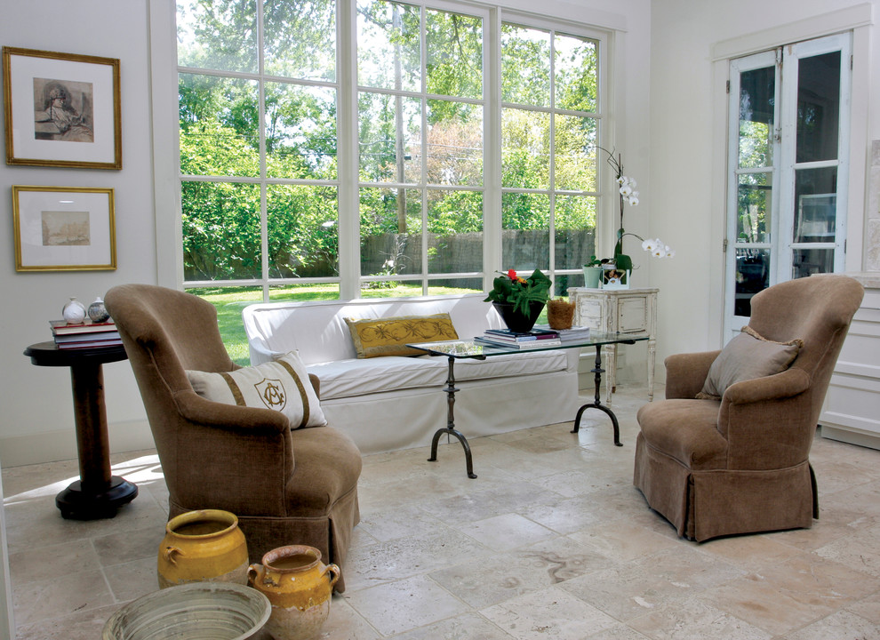 Example of an eclectic living room design in New Orleans with white walls