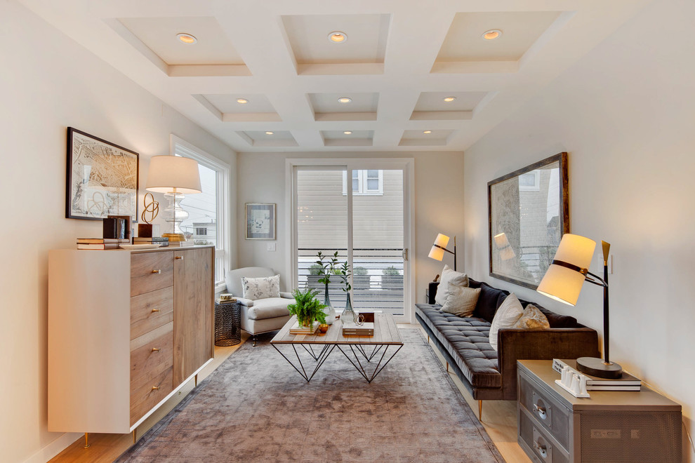 На фото: гостиная комната:: освещение в современном стиле с серыми стенами и светлым паркетным полом без камина, телевизора