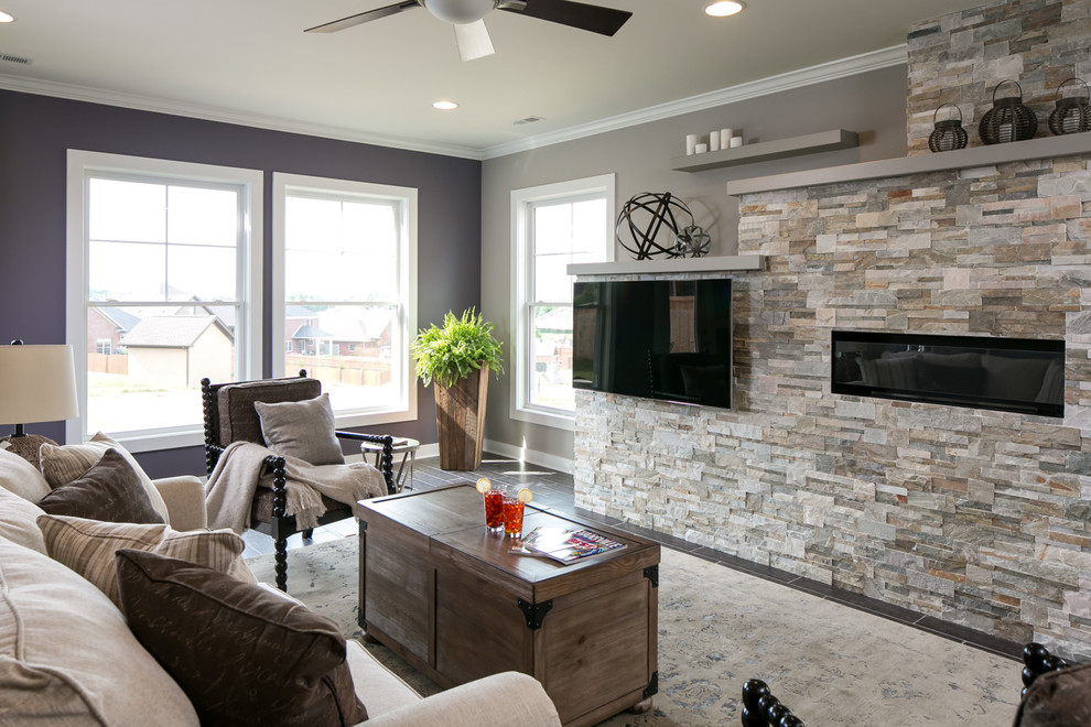 Mid-sized arts and crafts open concept porcelain tile and brown floor living room photo in Other with multicolored walls, a ribbon fireplace, a stone fireplace and a wall-mounted tv