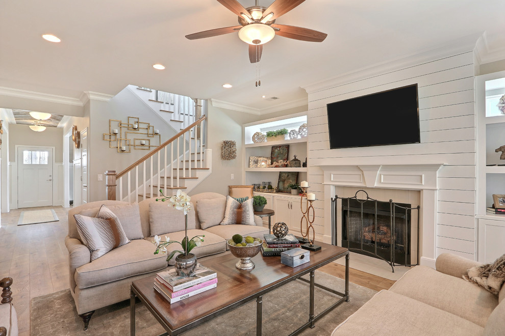 Design ideas for a large traditional open plan living room in Charleston with grey walls, dark hardwood flooring, a standard fireplace, a stone fireplace surround and a wall mounted tv.
