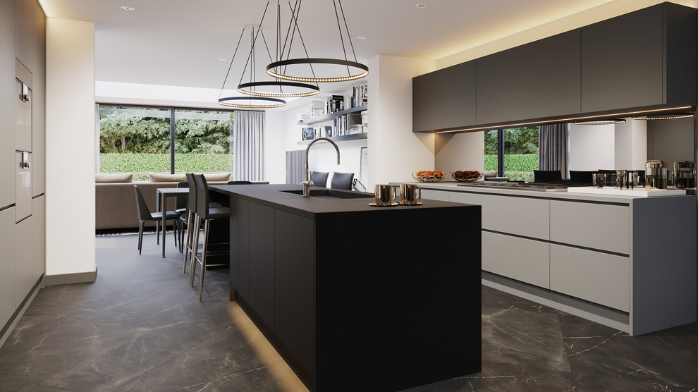 Inspiration for a medium sized contemporary open plan kitchen in London with a built-in sink, flat-panel cabinets, grey cabinets, mirror splashback, stainless steel appliances, porcelain flooring, an island, grey floors and grey worktops.