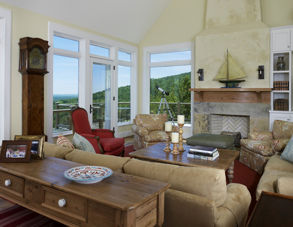 Example of a cottage living room design in DC Metro with yellow walls