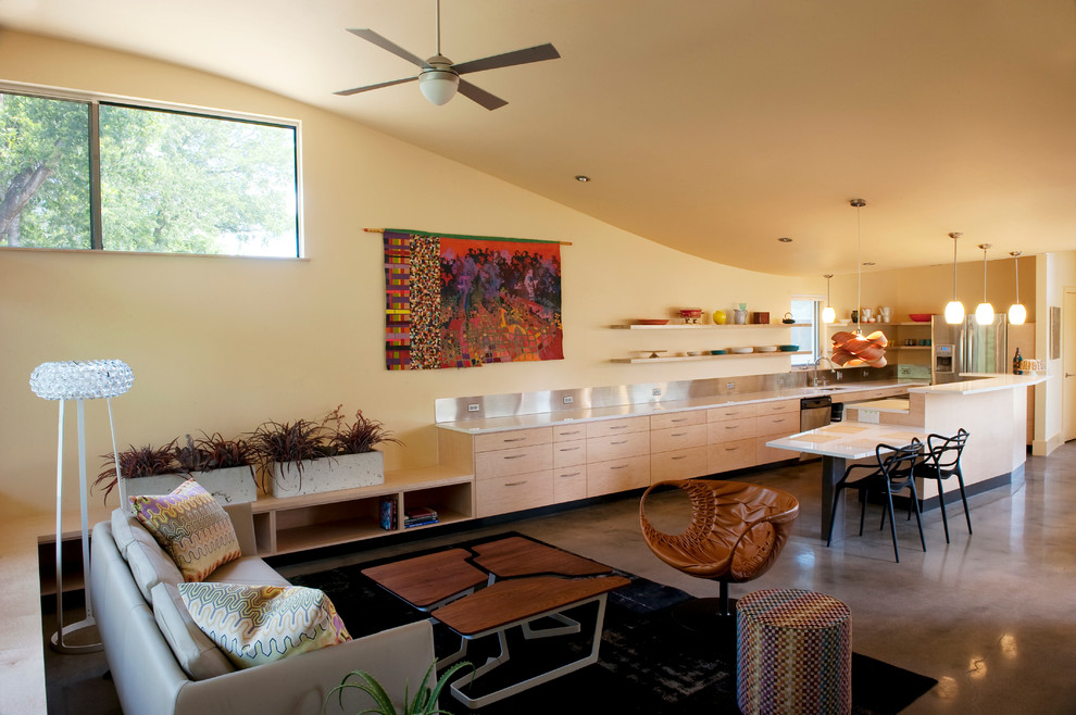 Example of a trendy formal and open concept concrete floor living room design in Austin with yellow walls