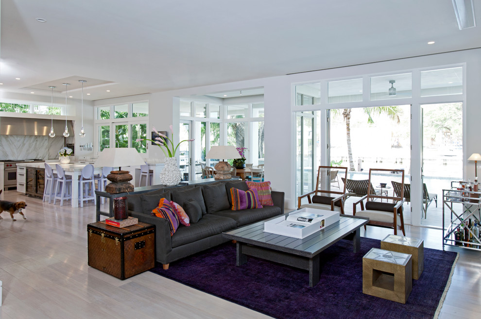 Trendy open concept living room photo in Miami with white walls
