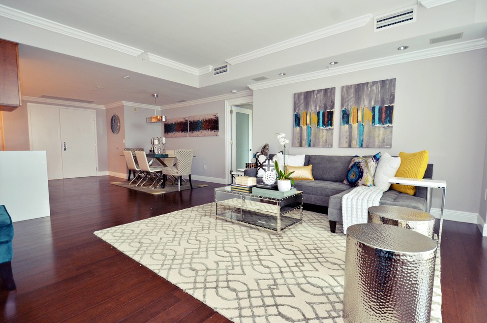 This is an example of a large contemporary open plan living room in Miami.
