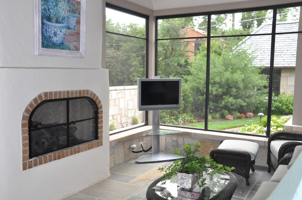 Mid-sized elegant enclosed slate floor and multicolored floor living room photo in Chicago with white walls, a standard fireplace, a tv stand and a brick fireplace