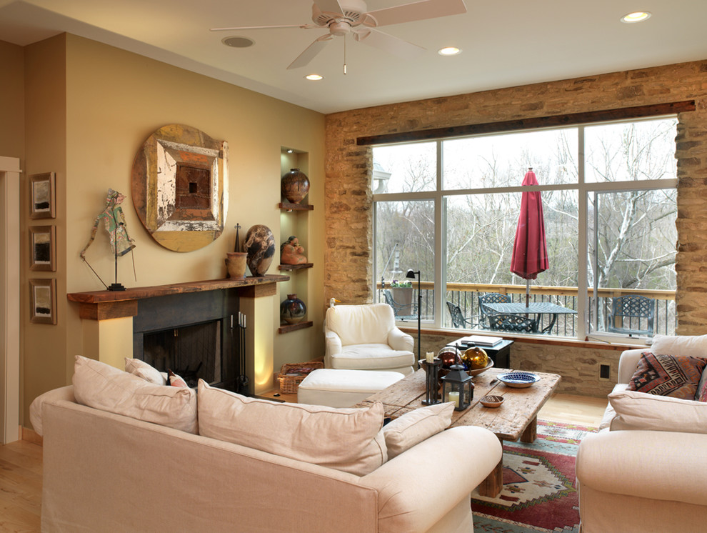 Rustic living room in Columbus with a standard fireplace.