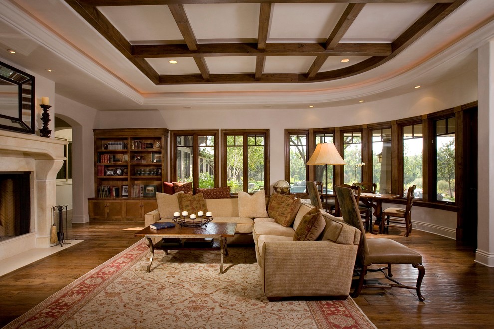 This is an example of a classic living room in Sacramento with beige walls and dark hardwood flooring.