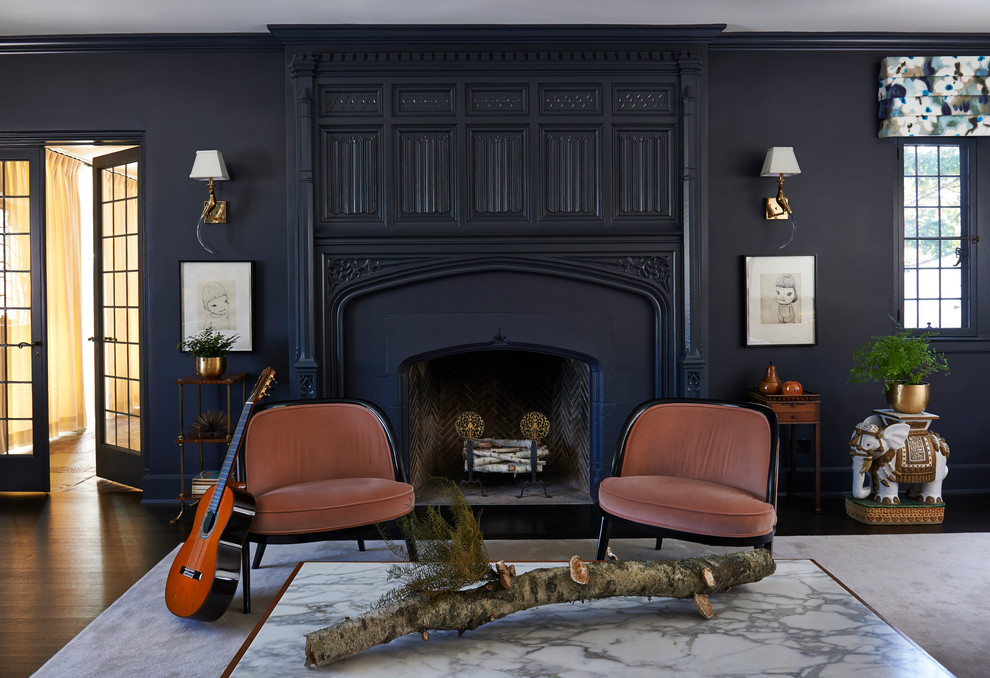 Traditional formal enclosed living room in New York with blue walls, dark hardwood flooring and a standard fireplace.