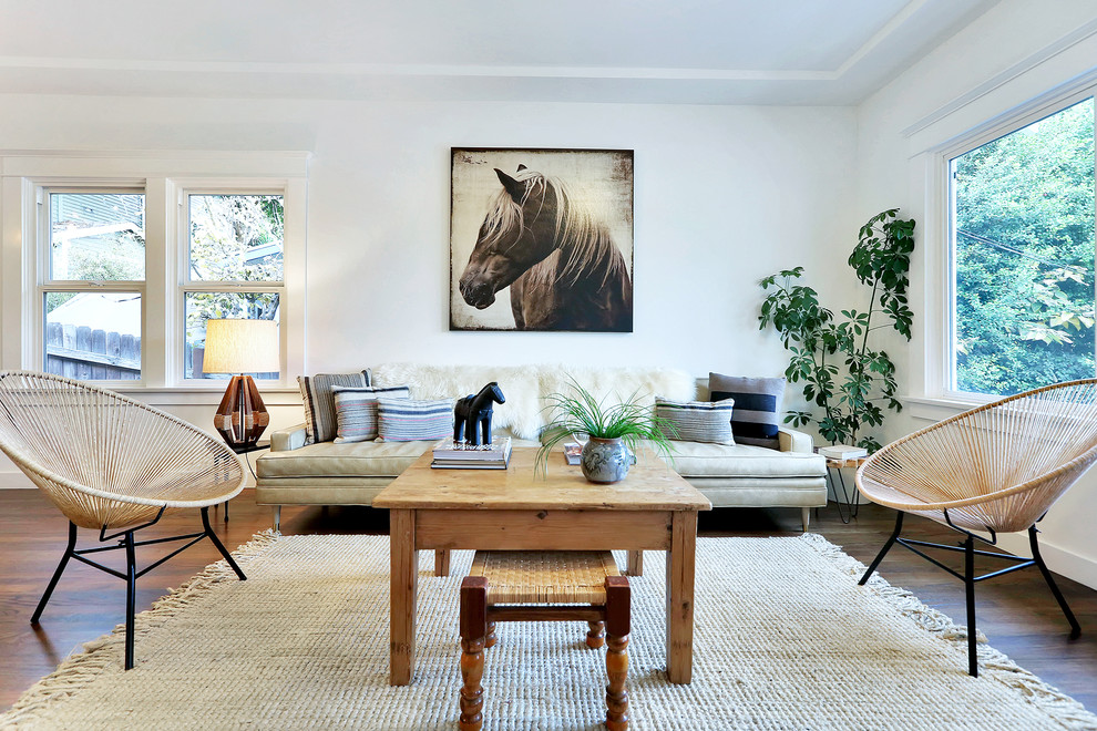Example of a transitional living room design in Los Angeles with white walls