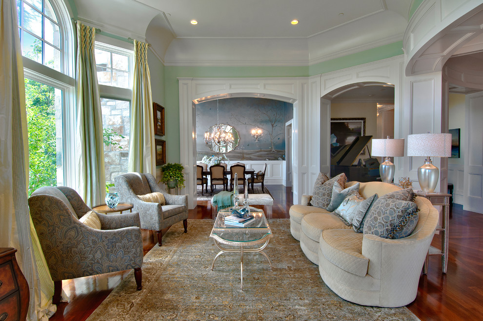 Immagine di un grande soggiorno tradizionale aperto con pareti verdi, sala formale, nessuna TV, pavimento marrone e pavimento in legno massello medio