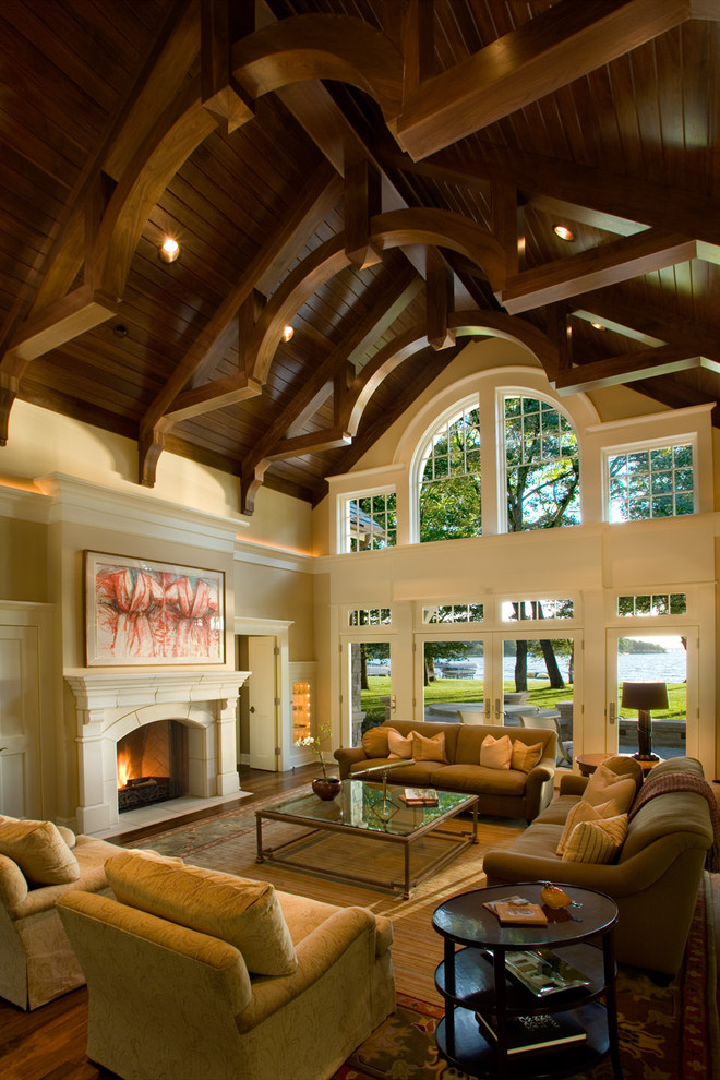 Expansive traditional living room in Minneapolis with beige walls, no tv and feature lighting.